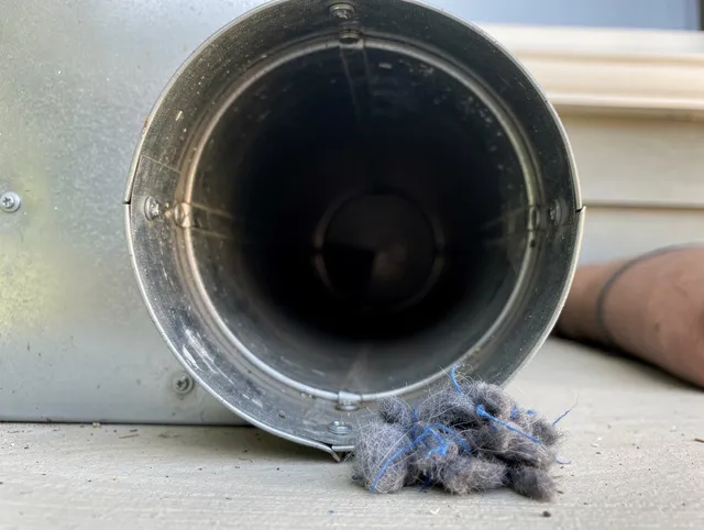 Middletown Dryer Vent Cleaning technician using specialized equipment to clear severe dryer vent blockage in Middletown